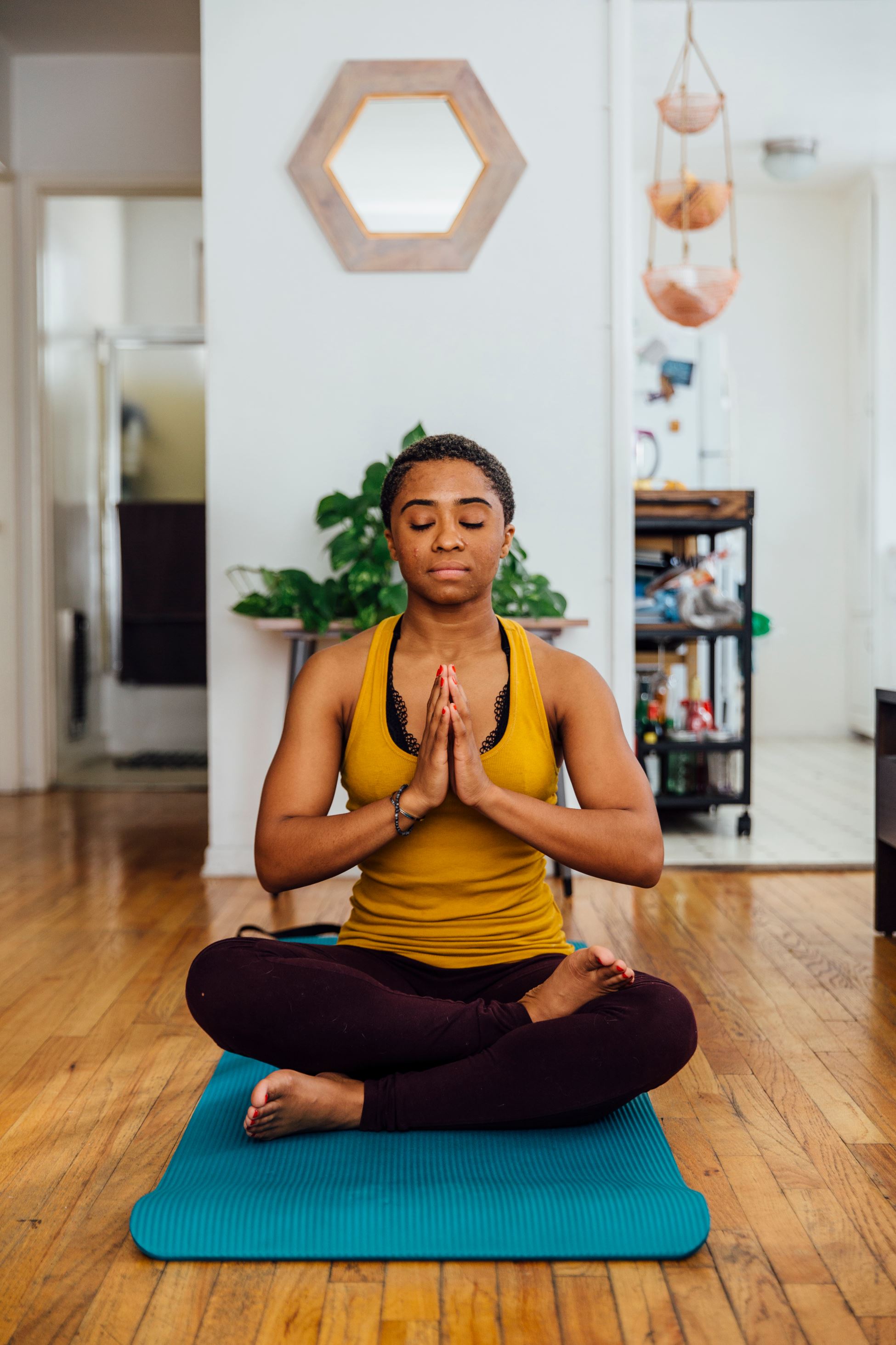 Person meditating at home. Microsoft Stock Images.